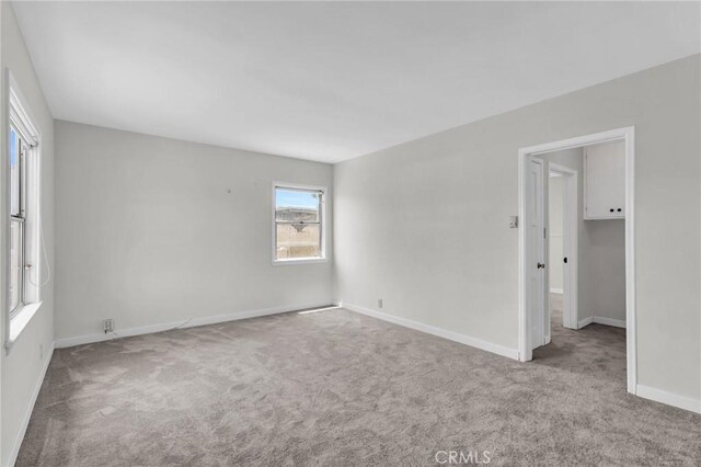 14403 S White Ave, Compton, CA 90221 - carpeted empty room with baseboards