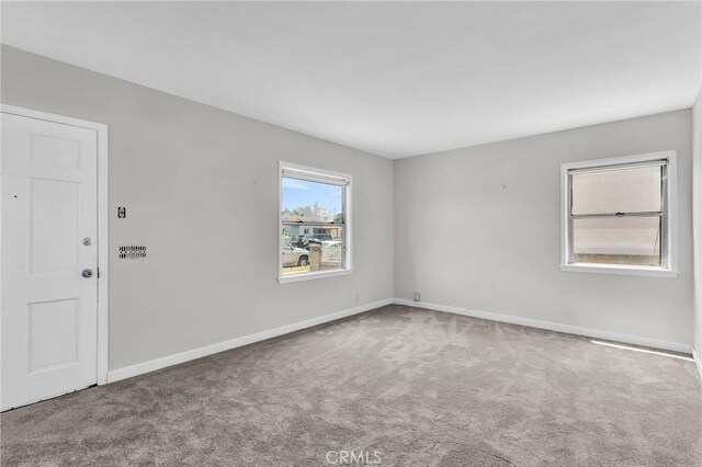 14403 S White Ave, Compton, CA 90221 - carpeted spare room featuring baseboards