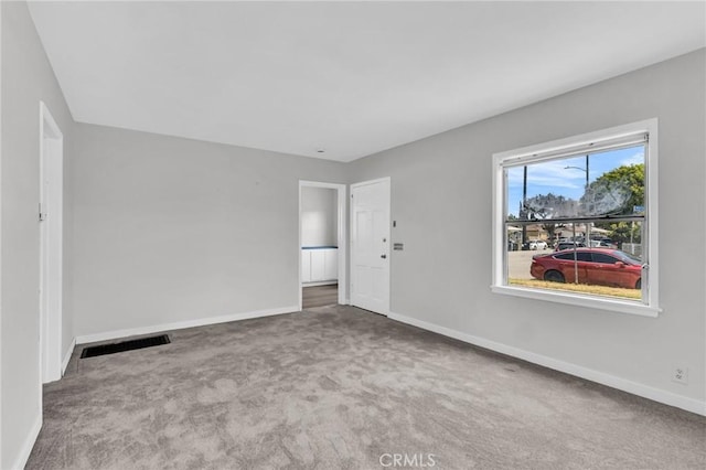 14403 S White Ave, Compton, CA 90221 - carpeted spare room featuring baseboards