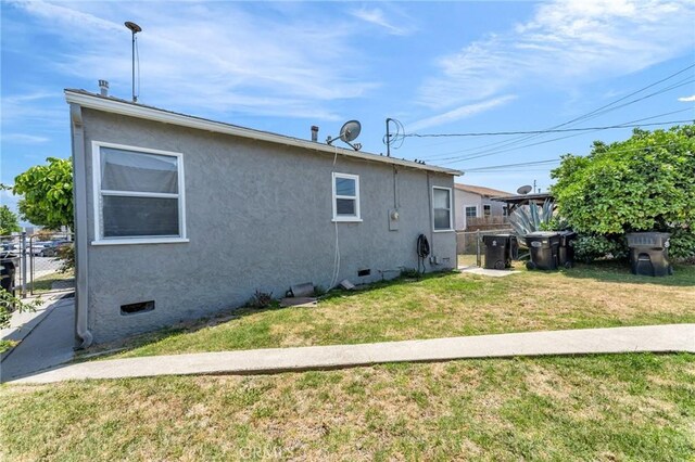 14403 S White Ave, Compton, CA 90221 - view of home's exterior featuring stucco siding and crawl space