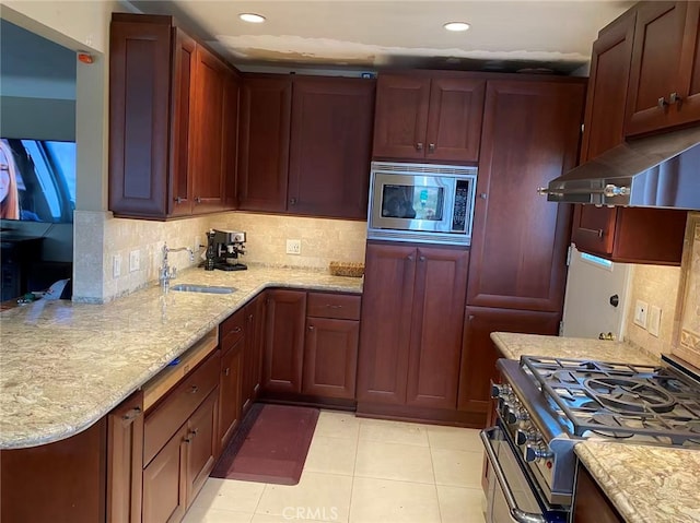 405 Waterview, Playa Del Rey, CA 90293 - kitchen with stainless steel appliances, a sink, under cabinet range hood, tasteful backsplash, and light stone countertops