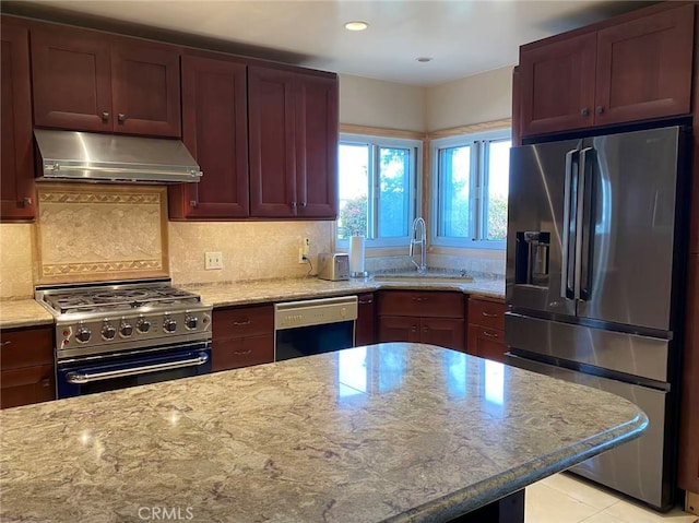 405 Waterview, Playa Del Rey, CA 90293 - kitchen with stainless steel appliances, extractor fan, a sink, light stone counters, and decorative backsplash
