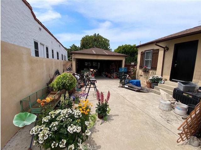 405 Waterview, Playa Del Rey, CA 90293 - view of patio / terrace with an outbuilding and a garage