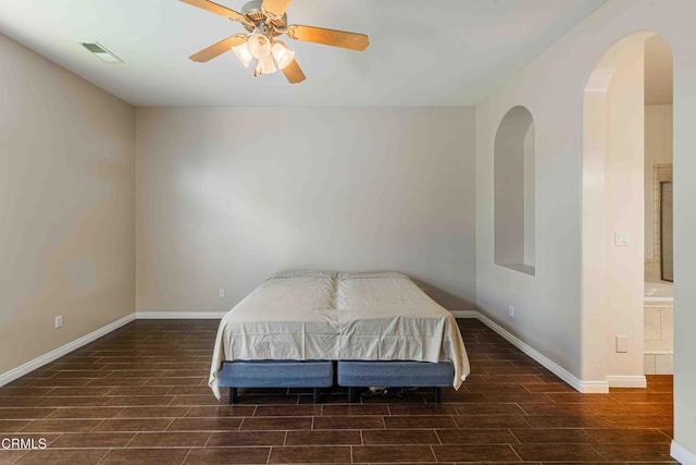 15617 Screaming Eagle Ave, Bakersfield, CA 93314 - bedroom with wood finish floors, arched walkways, baseboards, and a ceiling fan