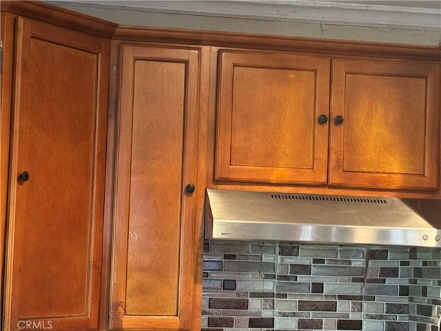 19549 Schoolcraft St, Reseda, CA 91335 - kitchen view of extractor fan, brown cabinets, and backsplash