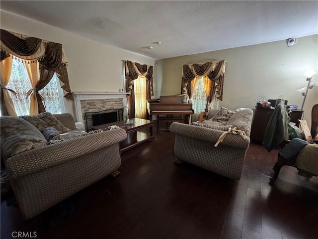 19549 Schoolcraft St, Reseda, CA 91335 - living room featuring a stone fireplace and dark wood-style flooring