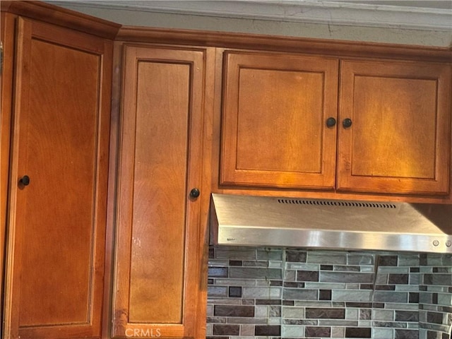 19549 Schoolcraft St, Reseda, CA 91335 - kitchen view of ventilation hood, brown cabinets, and backsplash