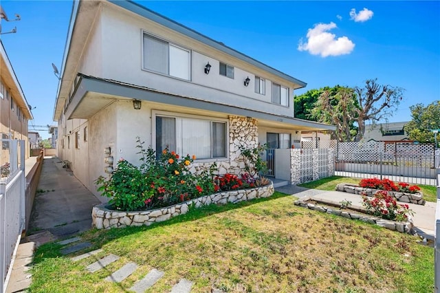 11726 Freeman Ave Unit A, Hawthorne, CA 90250 - rear view of property featuring stucco siding and a patio