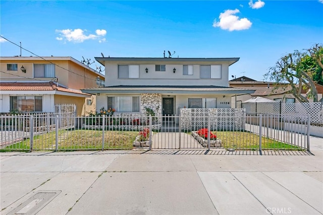 11726 Freeman Ave Unit A, Hawthorne, CA 90250 - view of front of home with stucco siding and a fenced front yard