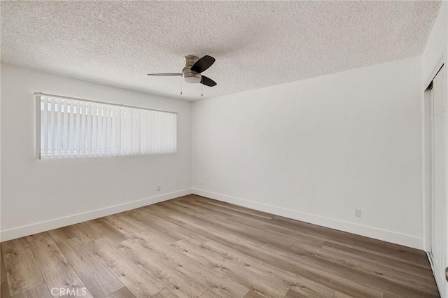 11726 Freeman Ave Unit A, Hawthorne, CA 90250 - spare room with healthy amount of natural light, ceiling fan, wood finished floors, a textured ceiling, and baseboards