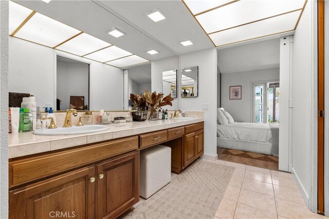 24232 Porto Nuovo, Dana Point, CA 92629 - ensuite bathroom featuring double vanity and tile patterned floors