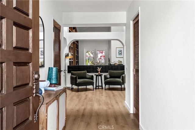 24232 Porto Nuovo, Dana Point, CA 92629 - entrance foyer featuring wood finished floors, baseboards, and arched walkways