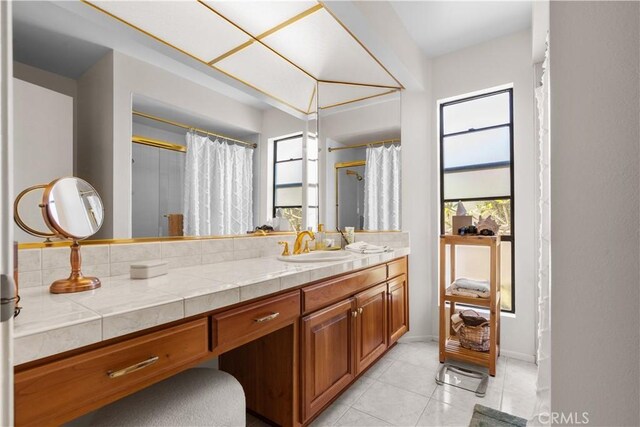 24232 Porto Nuovo, Dana Point, CA 92629 - full bath with healthy amount of natural light, vanity, tile patterned flooring, and curtained shower