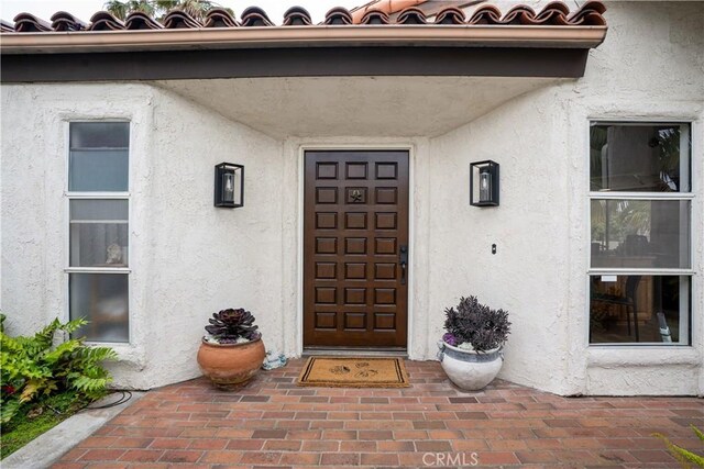 24232 Porto Nuovo, Dana Point, CA 92629 - doorway to property featuring stucco siding