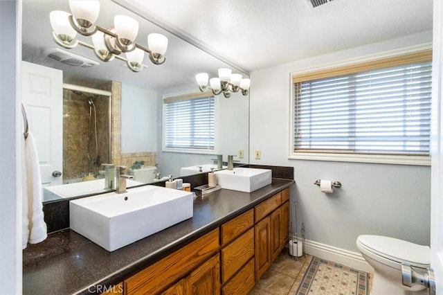 19921 Rambling Rd, Covina, CA 91724 - bathroom with toilet, double vanity, a chandelier, and baseboards