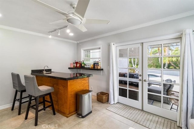 19921 Rambling Rd, Covina, CA 91724 - indoor wet bar featuring ornamental molding, ceiling fan, rail lighting, light tile patterned floors, and french doors