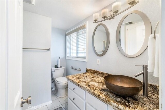 19921 Rambling Rd, Covina, CA 91724 - bathroom featuring vanity, toilet, and tile patterned floors