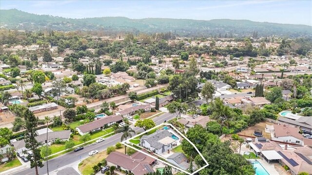 19921 Rambling Rd, Covina, CA 91724 - aerial perspective of suburban area featuring property boundaries highlighted and a mountain backdrop