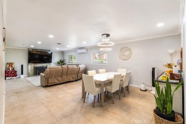 19921 Rambling Rd, Covina, CA 91724 - dining area with a wall unit AC, ornamental molding, light tile patterned floors, a fireplace, and a chandelier