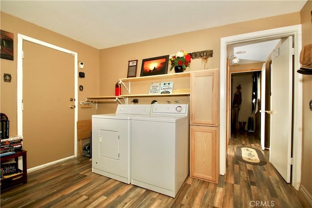 1910 Artesia Ave, Landers, CA 92285 - laundry area featuring washer and dryer, wood finished floors, and cabinet space