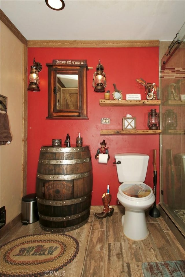 1910 Artesia Ave, Landers, CA 92285 - bathroom with a stall shower and wood finished floors