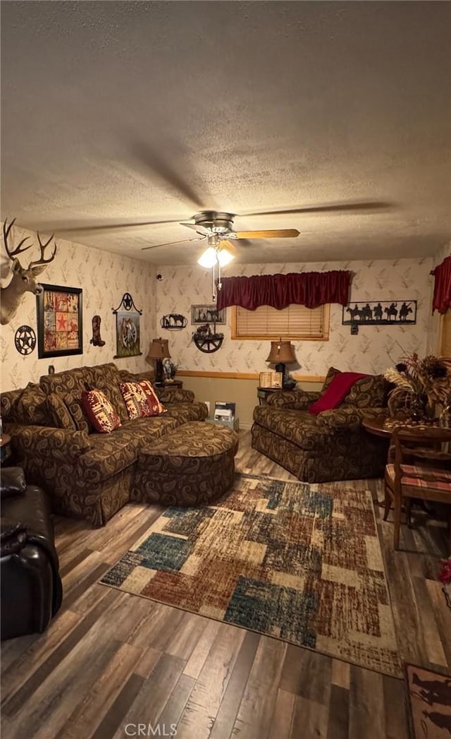 1910 Artesia Ave, Landers, CA 92285 - living room featuring a textured ceiling, wood finished floors, and ceiling fan