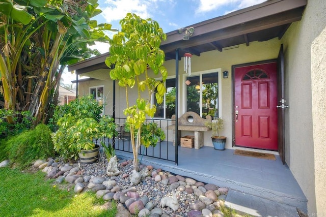 118 W 11th Ave, Escondido, CA 92025 - doorway to property with stucco siding and a porch