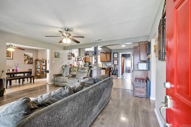 118 W 11th Ave, Escondido, CA 92025 - living area with ceiling fan, baseboards, and light wood-style flooring