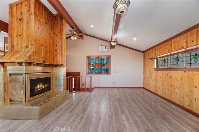 26745 Hopkins Rd, Idyllwild, CA 92549 - unfurnished living room featuring wood finished floors, baseboards, wood walls, a fireplace, and ceiling fan