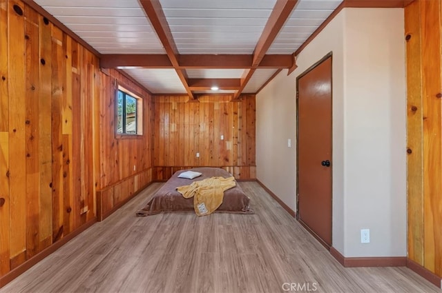 26745 Hopkins Rd, Idyllwild, CA 92549 - unfurnished bedroom featuring light wood finished floors, beam ceiling, wooden walls, and baseboards