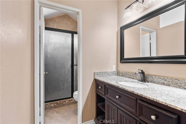 1214 Mallorca St, Upland, CA 91784 - bathroom with vanity, toilet, a shower stall, and tile patterned floors