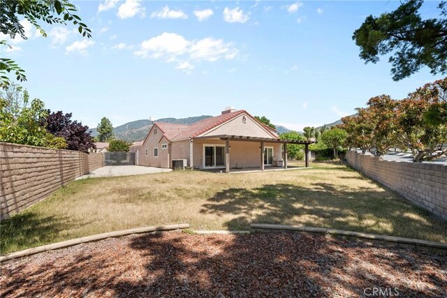 1214 Mallorca St, Upland, CA 91784 - rear view of house with a patio area, stucco siding, and a mountain view