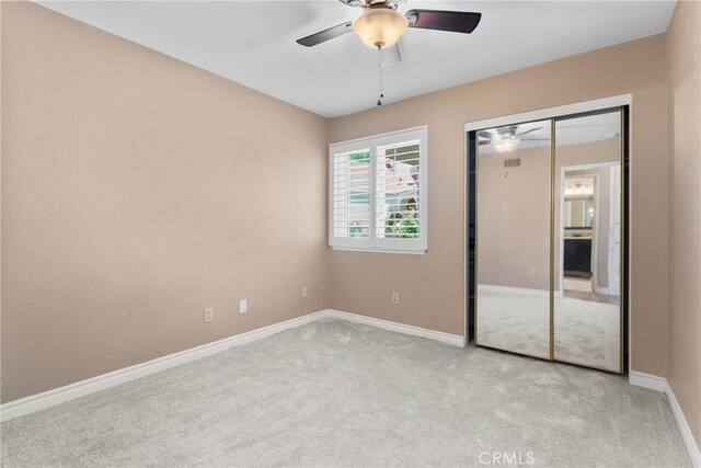 1214 Mallorca St, Upland, CA 91784 - unfurnished bedroom featuring light colored carpet, baseboards, a closet, and ceiling fan