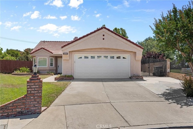 1214 Mallorca St, Upland, CA 91784 - view of front of property featuring driveway, a tile roof, stucco siding, and a garage