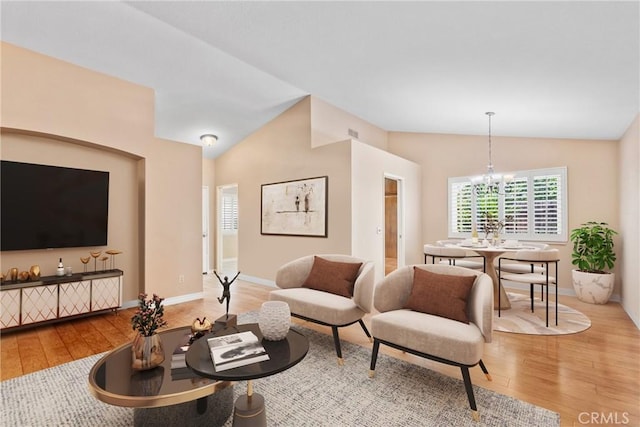 1214 Mallorca St, Upland, CA 91784 - living area featuring vaulted ceiling, wood-type flooring, a chandelier, and baseboards