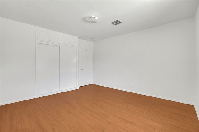 233 Russell Ave, Monterey Park, CA 91755 - unfurnished bedroom with light wood finished floors, a closet, and baseboards