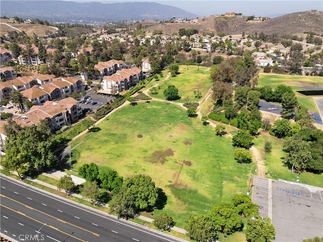 1023 Vista Del Cerro Dr Unit 205, Corona, CA 92879 - aerial view of property's location with a mountain backdrop and nearby suburban area