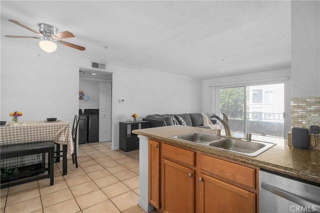 1023 Vista Del Cerro Dr Unit 205, Corona, CA 92879 - kitchen with dishwasher, a sink, washer and dryer, open floor plan, and ceiling fan