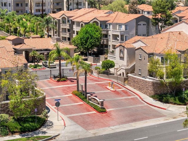 1023 Vista Del Cerro Dr Unit 205, Corona, CA 92879 - view of home's community featuring a residential view and a gate