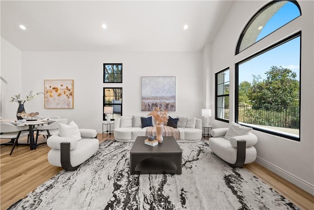 22011 La Puente Rd, Walnut, CA 91789 - living room with wood finished floors, recessed lighting, and baseboards