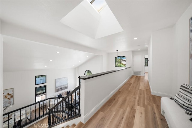 22011 La Puente Rd, Walnut, CA 91789 - hallway featuring an upstairs landing, healthy amount of natural light, light wood finished floors, recessed lighting, and baseboards