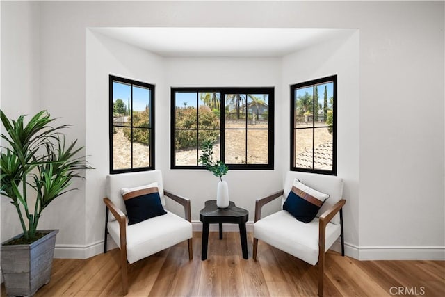 22011 La Puente Rd, Walnut, CA 91789 - sitting room featuring wood finished floors and baseboards