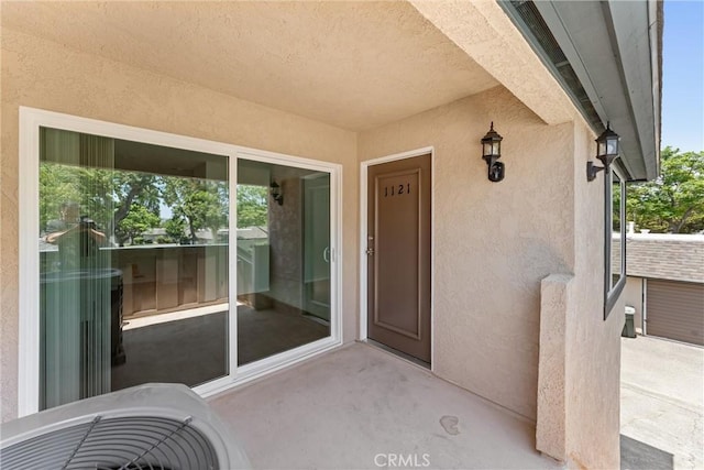 1121 S Dover Cir Unit C44K, Anaheim, CA 92805 - doorway to property with stucco siding
