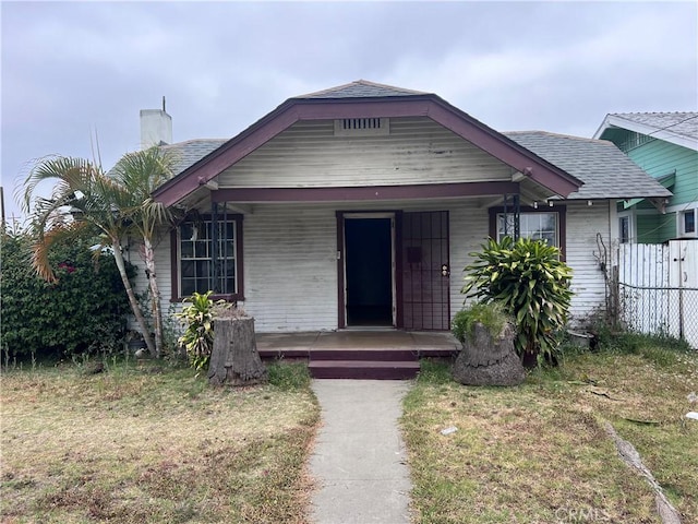 1903 E 59th St, Long Beach, CA 90805 - bungalow-style house with a porch and a chimney