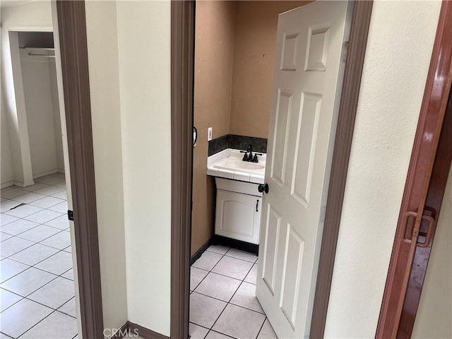 1903 E 59th St, Long Beach, CA 90805 - bathroom with tile patterned floors, vanity, and baseboards