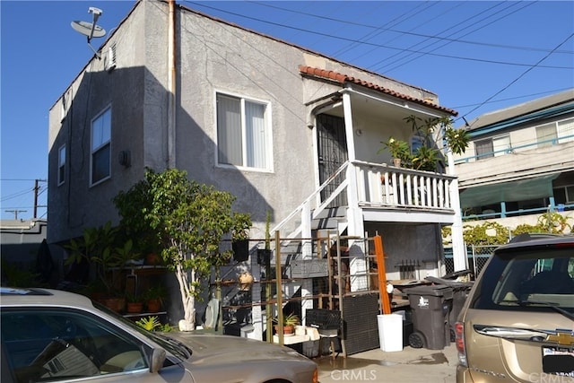 1452 Pacific Ave, Long Beach, CA 90813 - view of property with stucco siding and stairs