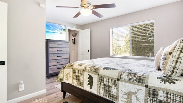 27638 St Bernard Ln, Lake Arrowhead, CA 92352 - bedroom with wood finished floors and a ceiling fan