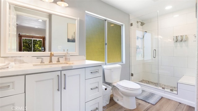 27638 St Bernard Ln, Lake Arrowhead, CA 92352 - bathroom with vanity, a stall shower, wood finished floors, and recessed lighting