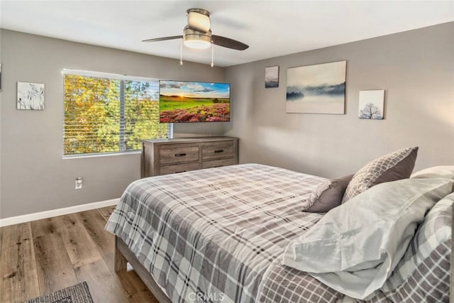 27638 St Bernard Ln, Lake Arrowhead, CA 92352 - bedroom with wood finished floors and a ceiling fan