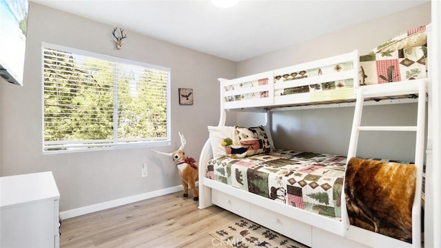 27638 St Bernard Ln, Lake Arrowhead, CA 92352 - bedroom featuring wood finished floors and baseboards